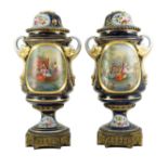 A pair of Sevres style Paris porcelain and ormolu mounted oil lamps, late 19th century, each painted