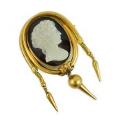 A Victorian gold and cameo agate set oval drop tassel brooch, the stone carved with the bust of a