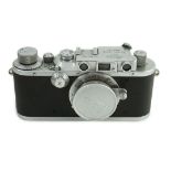 A Leica IIIa camera, number 302196 with Leitz Elmar F51:35 lens, Elmar 5cm adapter ring and