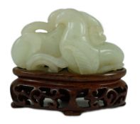 A Chinese pale celadon jade ‘Lotus’ pebble carving, 18th/19th century, the stone of good even tone