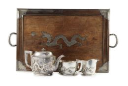 An early 20th century Chinese Export three piece silver tea set and matching silver inlaid