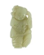 A Chinese celadon jade figure of a boy holding a lotus sprig, 19th century 5.2 cm highShallow
