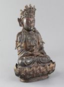 A Chinese lacquered bronze seated figure of Guanyin, possibly Ming dynasty, 31cm highSeries of small