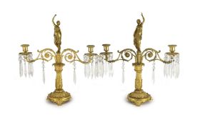 A pair of 19th century Grecian revival ormolu two lights candelabra, with classical goddess finials,