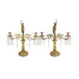 A pair of 19th century Grecian revival ormolu two lights candelabra, with classical goddess finials,