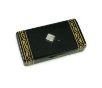 A late 1920's French Cartier silver gilt, black enamel and diamond set snuff box, in fitted gilt