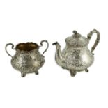 An early Victorian silver teapot and matching sugar bowl, by John Wellby, both engraved with