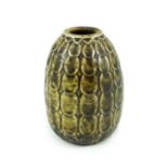 A Martin Brothers scale pattern ovoid small vase, dated 1910, covered in an olive green glaze,