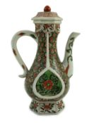 A Chinese famille verte small ewer and cover, Kangxi period, of pear shape each side decorated