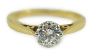 A 1960's 18ct gold and solitaire diamond ring, the stone weighing approximately 0.50ct, gross weight