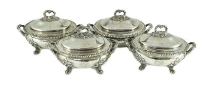 A good set of four Victorian silver two handled oval sauce tureens and covers, by Edward & John