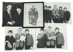 An autographed Beatles photograph and four related photographs of the Beatles with Peter Aldersley