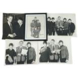 An autographed Beatles photograph and four related photographs of the Beatles with Peter Aldersley