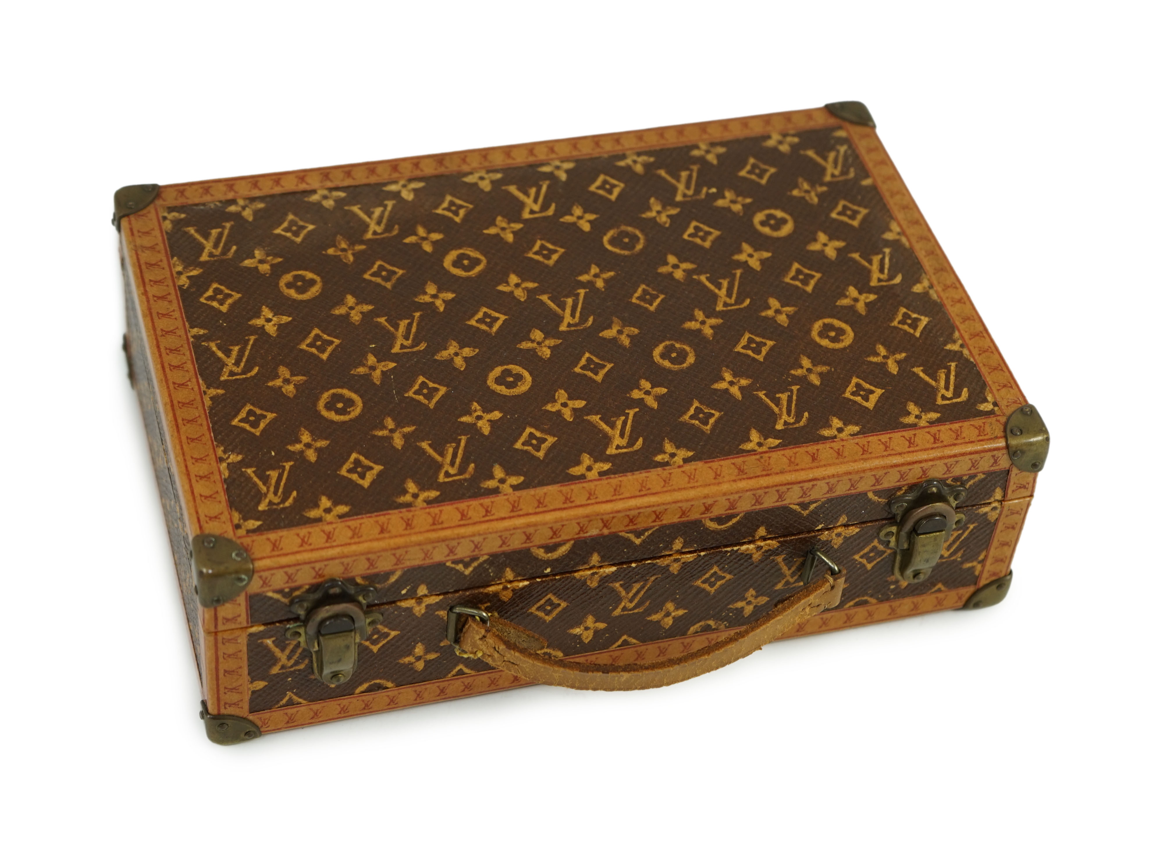 A 1920’s Louis Vuitton miniature suitcase, stamped L.Vuitton, 20 x 13 x 6cm.Overall of good original - Image 2 of 2