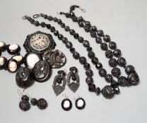 A collection of assorted jet jewellery, some with cameo, including two necklaces, five brooches, a