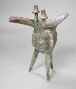A Chinese jue archaistic bronze tripod vessel - 19.5cm tall