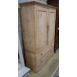 A Victorian pine two drawer hanging cupboard, width 123cm, depth 48cm, height 183cm