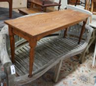 An Arts and Crafts rectangular oak low table / bench, length 122cm, depth 37cm, height 48cm