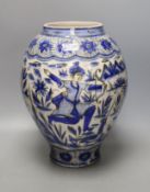 A large Persian pottery jar ‘hunting scene’ jar, Safavid style, 19th century, 33cm