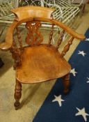 A Victorian elm and beech pierced back bow smoker's chair, width 66cm, depth 45cm, height 80cm