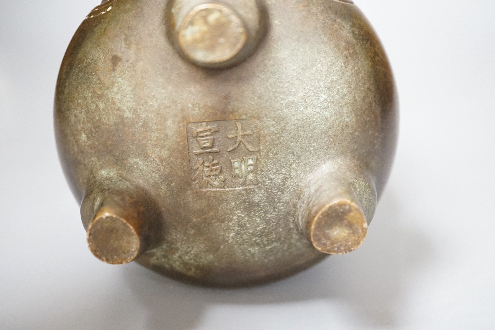 A Chinese bronze tripod Islamic market censer, Xuande mark - 13cm tall - Image 4 of 4