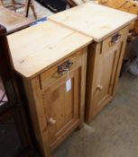 A near pair of 19th century continental pine bedside cabinets, larger width 40cm, depth 38cm, height