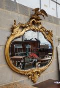 A large carved late Victorian gilt framed wall mirror, width 112cm, height 115cm