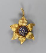 A modern 18ct gold and sapphire cluster set flower brooch, 55mm, gross weight 15.1 grams.