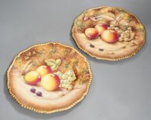 A pair of Royal Worcester fruit painted dinner plates, post war, by D. Shinnie and T. Nutt, 27cm