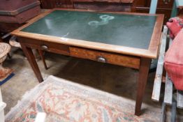 A 1920's oak two drawer writing table, width 136cm, depth 76cm, height 77cm