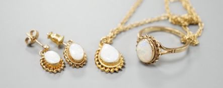 A modern suite of 9ct gold and white opal jewellery, comprising a ring, pendant on chain and pair of