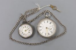 An Edwardian Waltham silver open face keywind pocket watch and a Swiss 935 white metal fob watch, on