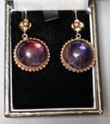 A pair of yellow metal mounted foil backed cabochon amethyst paste set drop earrings, overall