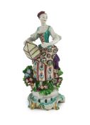 A Bow porcelain figure of a lady, emblematic of Matrimony, c.1765, the figure modelled holding a