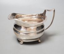 A George III silver cream jug, marks rubbed, 154 grams.