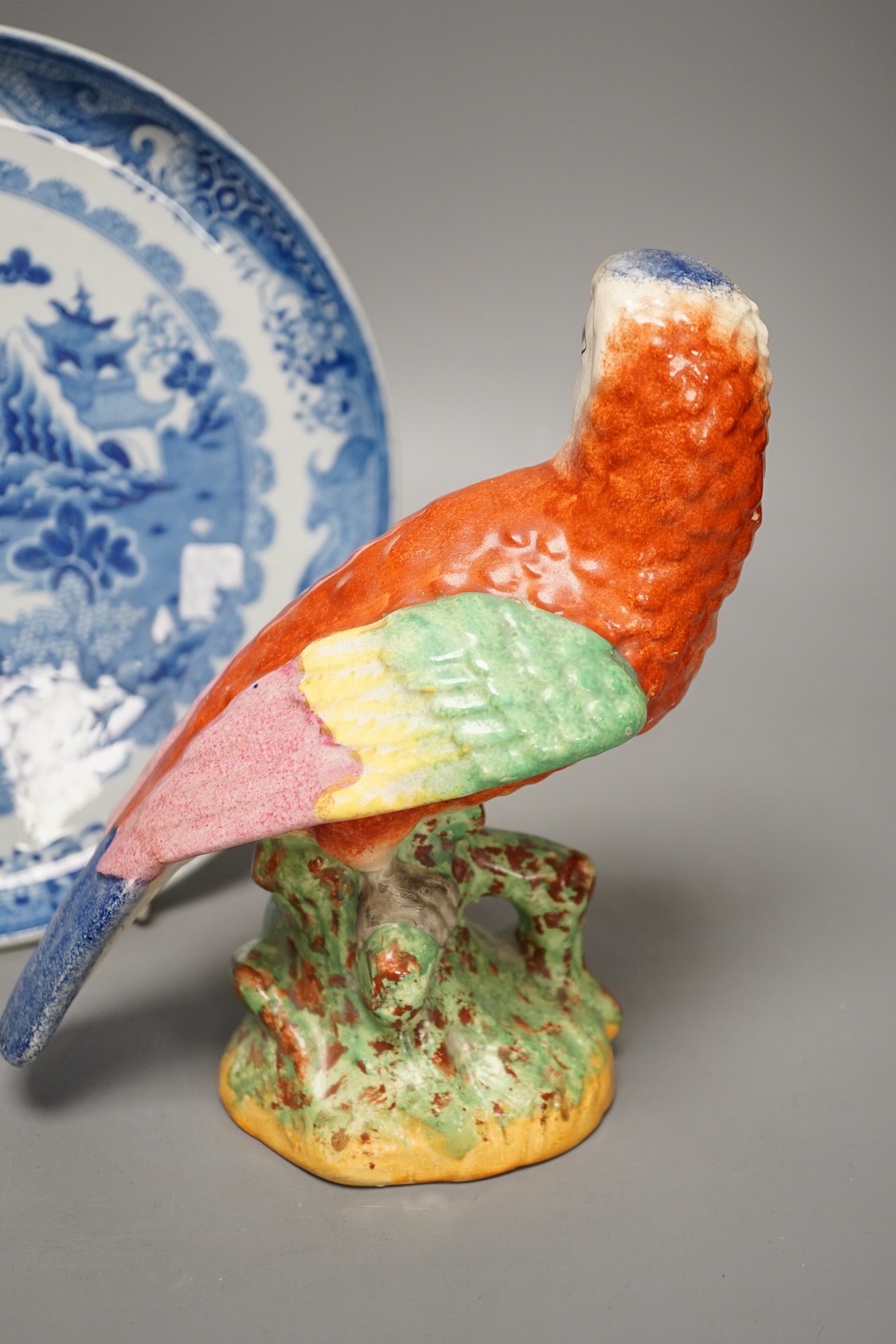 A Staffordshire pottery figure of a parrot, 19.5cm tall, together with a blue and white dish - Image 3 of 5