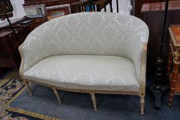 A French painted parcel gilt framed settee, length 148cm, depth 60cm, height 89cm