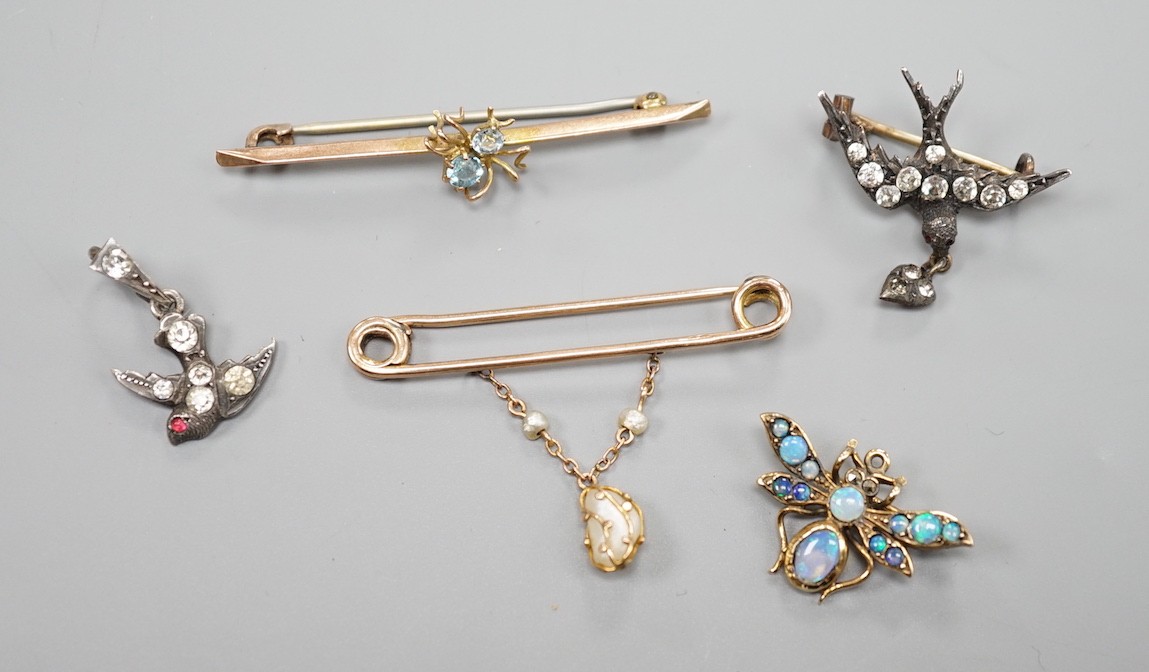 A modern 9ct gold and opal set bug brooch, 24mm, a paste set white metal swallow pendant and similar