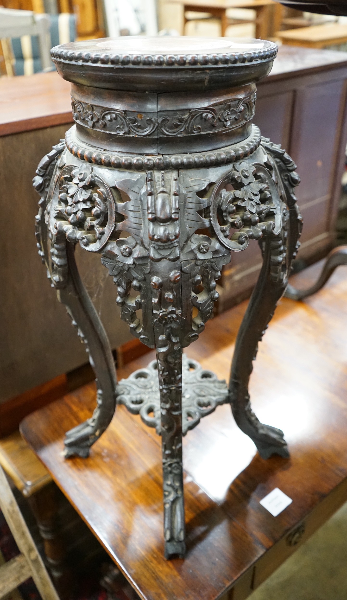 A Chinese carved hardwood marble topped vase stand, width 30cm, height 66cm