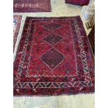 A Caucasian design red ground rug, 200 x 160cm