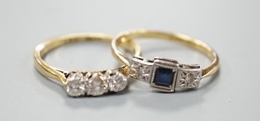 An 18ct and three stone diamond ring, size L/M and an 18ct, sapphire and diamond chip set three