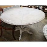 A Victorian style circular painted pine circular dining table on painted cast metal base, diameter