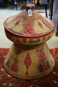 A large African woven basket, height 76cm