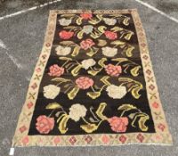 An Anatolian style polychrome floral flatweave carpet, 240 x 156 cms.