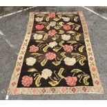 An Anatolian style polychrome floral flatweave carpet, 240 x 156 cms.