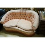 A mid century tub frame settee upholstered in buttoned pink damask, length 160cm, depth 76cm, height