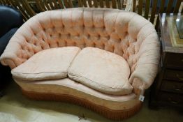 A mid century tub frame settee upholstered in buttoned pink damask, length 160cm, depth 76cm, height