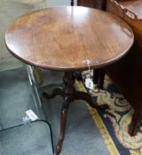 A George III circular mahogany tilt top tripod tea table, diameter 65cm, height 72cm