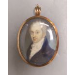 A late Georgian portrait miniature of a gentleman, with memorial hair plaque and monogram on