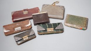 Five assorted early 20th century silver mounted leather purses including Art Nouveau, a similar